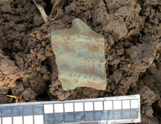 Fragment bronzového srpu