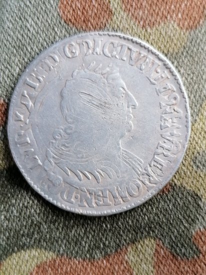 Přerážená stříbrná mince
