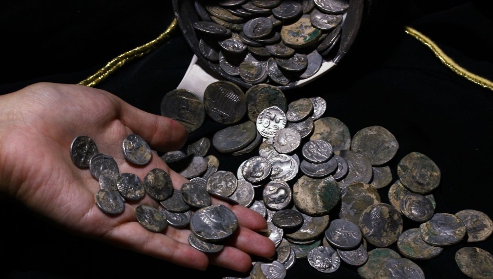2,000-year-old hoard of silver coins found on the bank of a stream