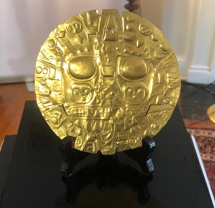 A 2,000-year-old golden disk - a symbol of national identity - has returned to Peru after 170 years